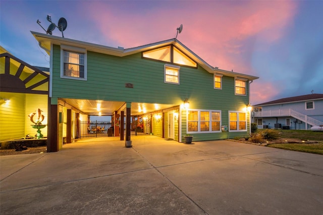 792 W Bayshore Dr, Palacios, TX 77465 - coastal home with a carport, concrete driveway, and central AC unit