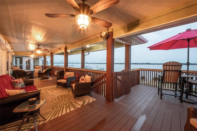 792 W Bayshore Dr, Palacios, TX 77465 - wooden terrace featuring an outdoor living space and a water view