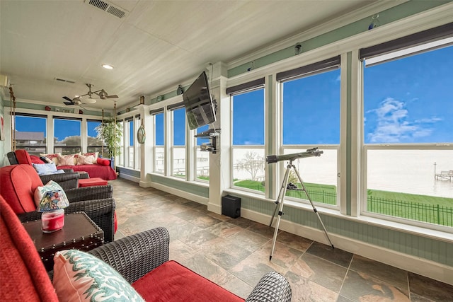 792 W Bayshore Dr, Palacios, TX 77465 - sunroom / solarium with baseboards, stone tile floors, and recessed lighting