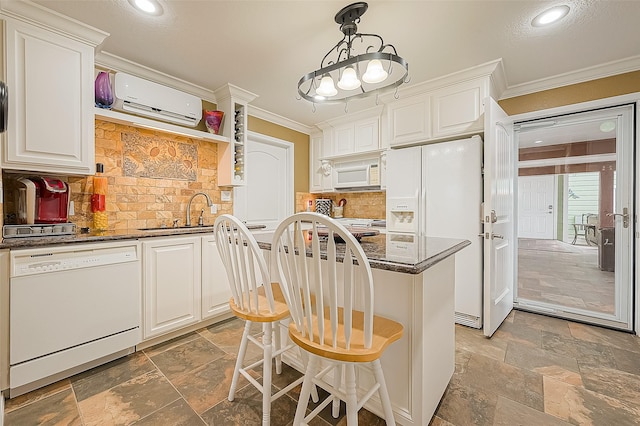 792 W Bayshore Dr, Palacios, TX 77465 - kitchen featuring white appliances, crown molding, a sink, a wall unit AC, and stone tile floors