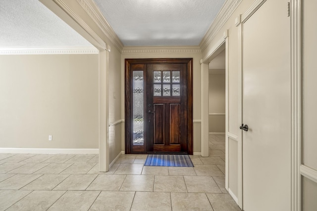 12114 Knobcrest Dr, Houston, TX 77070 - foyer featuring a textured ceiling, light tile patterned floors, baseboards, and ornamental molding