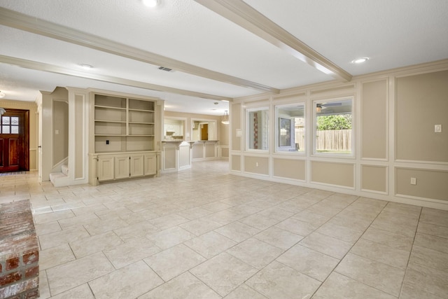 12114 Knobcrest Dr, Houston, TX 77070 - unfurnished living room with a decorative wall, ornamental molding, built in shelves, stairs, and recessed lighting