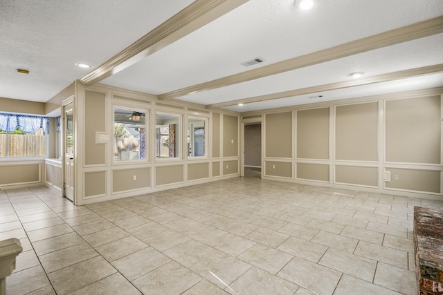 12114 Knobcrest Dr, Houston, TX 77070 - empty room with a textured ceiling, a decorative wall, recessed lighting, and tile patterned flooring