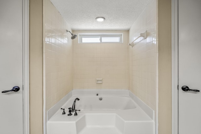 12114 Knobcrest Dr, Houston, TX 77070 - full bath featuring a textured ceiling and  shower combination