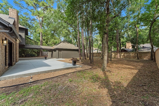 38 Falling Star Ct, The Woodlands, TX 77381 - fenced backyard featuring a patio