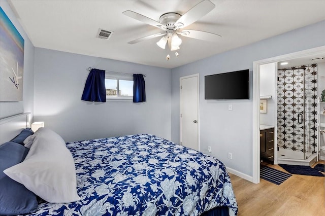 4220 Las Palmas St, Galveston, TX 77554 - bedroom with wood finished floors, ceiling fan, and ensuite bathroom