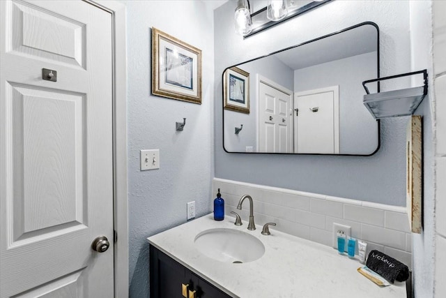 4220 Las Palmas St, Galveston, TX 77554 - bathroom with vanity and a textured wall
