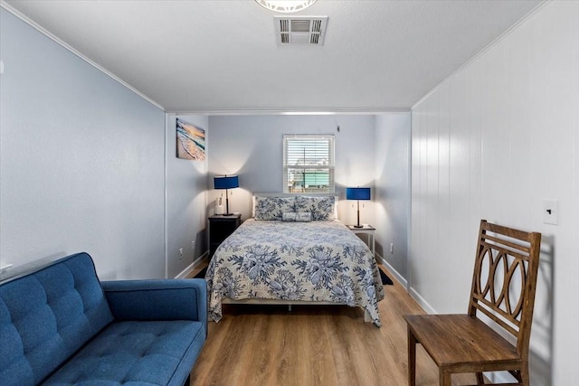 4220 Las Palmas St, Galveston, TX 77554 - bedroom with ornamental molding and wood finished floors