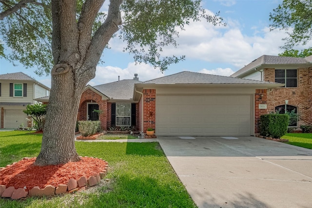 11826 Balmorhea Ln, Sugar Land, TX 77498 - view of front of property featuring brick siding, an attached garage, a front lawn, and driveway