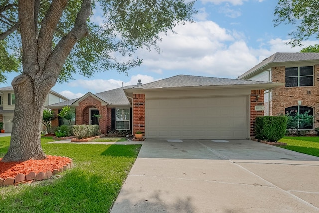 11826 Balmorhea Ln, Sugar Land, TX 77498 - view of front of house featuring brick siding, a front lawn, a garage, and driveway