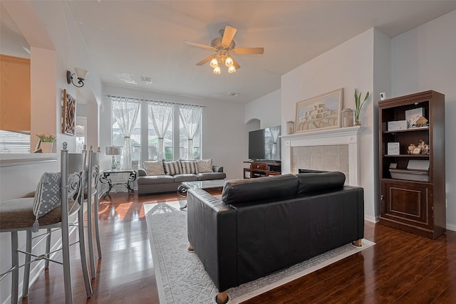 11826 Balmorhea Ln, Sugar Land, TX 77498 - living room with wood finished floors, ceiling fan, and a tile fireplace