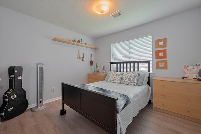 11826 Balmorhea Ln, Sugar Land, TX 77498 - bedroom with wood finished floors and baseboards