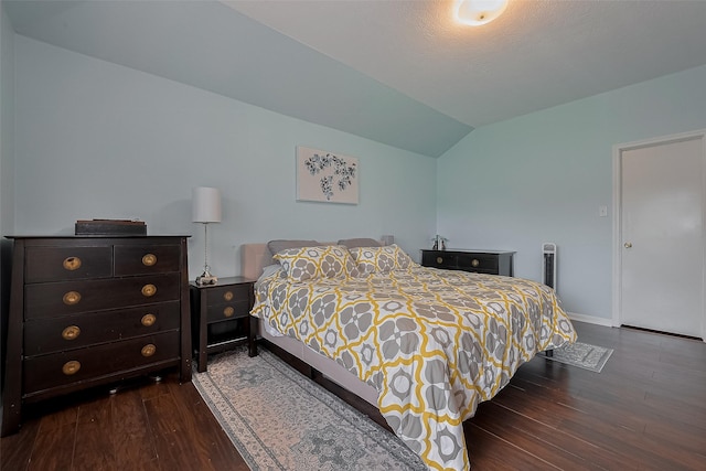 11826 Balmorhea Ln, Sugar Land, TX 77498 - bedroom with lofted ceiling, dark wood finished floors, and baseboards