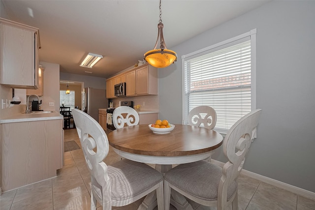 11826 Balmorhea Ln, Sugar Land, TX 77498 - dining room featuring light tile patterned floors and baseboards