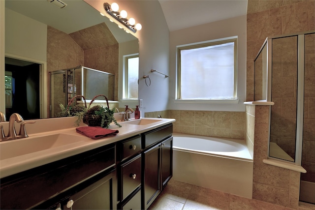 24302 Marisa Ln, Richmond, TX 77406 - bathroom with a stall shower, a bath, double vanity, tile patterned flooring, and lofted ceiling