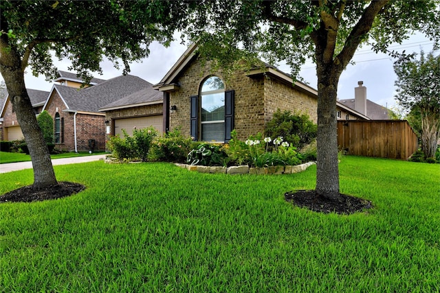 24302 Marisa Ln, Richmond, TX 77406 - view of front of home featuring brick siding, an attached garage, and roof with shingles