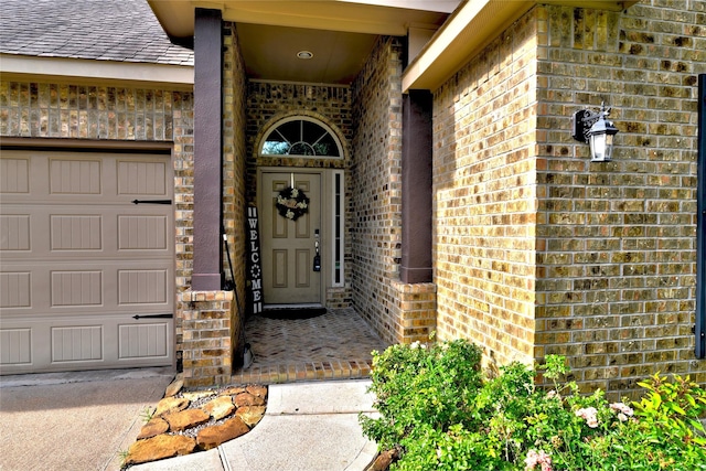 24302 Marisa Ln, Richmond, TX 77406 - doorway to property featuring brick siding, a shingled roof, and an attached garage