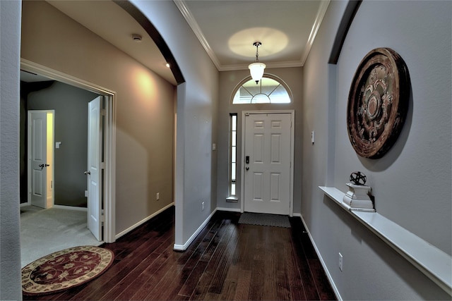 24302 Marisa Ln, Richmond, TX 77406 - foyer entrance featuring ornamental molding, wood finished floors, and arched walkways