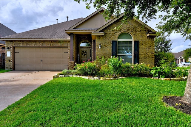 24302 Marisa Ln, Richmond, TX 77406 - view of front of home with brick siding, an attached garage, concrete driveway, a front lawn, and roof with shingles