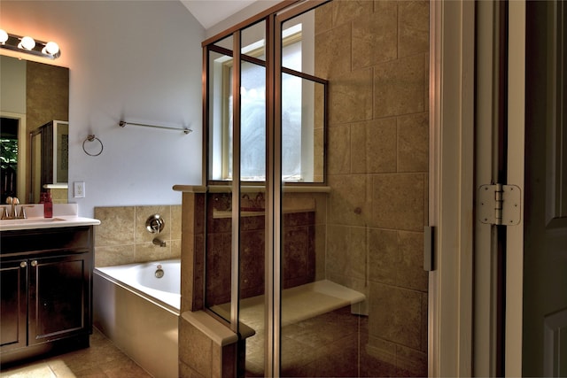 24302 Marisa Ln, Richmond, TX 77406 - full bathroom with vanity, a bath, a stall shower, and plenty of natural light