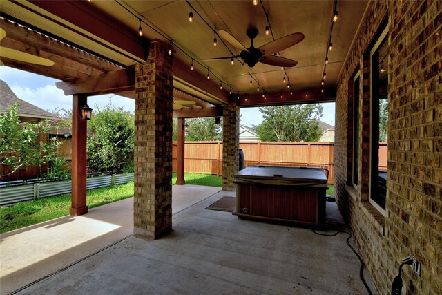 24302 Marisa Ln, Richmond, TX 77406 - fenced backyard featuring a patio, a ceiling fan, and a hot tub