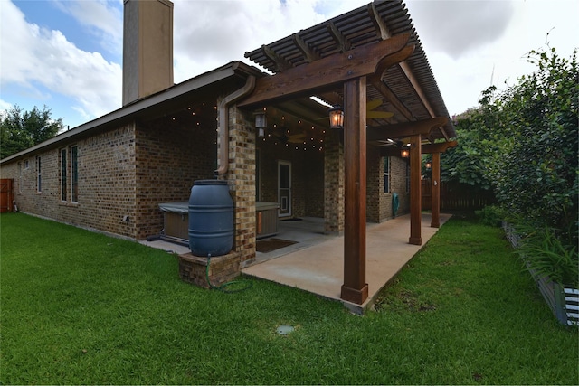 24302 Marisa Ln, Richmond, TX 77406 - rear view of house with a chimney, brick siding, and a patio area
