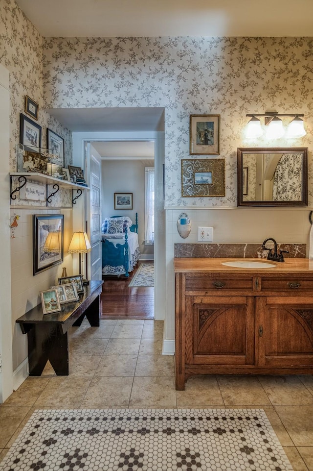 314 W Vulcan St, Brenham, TX 77833 - bathroom featuring vanity and wallpapered walls