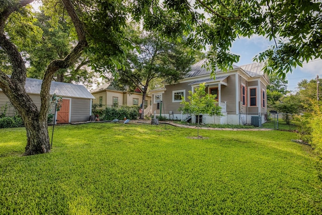 314 W Vulcan St, Brenham, TX 77833 - view of front of property featuring a storage shed and a metal roof