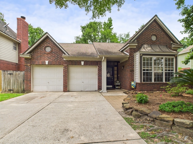 3707 Scenic Valley Dr, Kingwood, TX 77345 - view of front of house featuring an attached garage, brick siding, concrete driveway, and a shingled roof