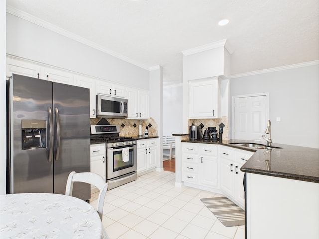 3707 Scenic Valley Dr, Kingwood, TX 77345 - kitchen featuring stainless steel appliances, a sink, tasteful backsplash, light tile patterned floors, and ornamental molding