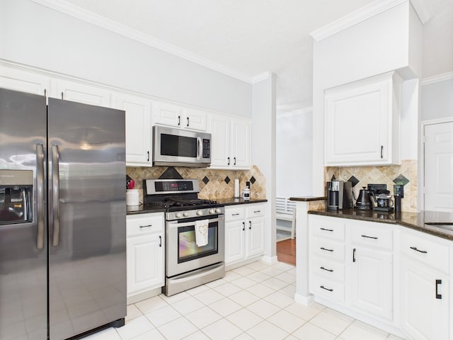 3707 Scenic Valley Dr, Kingwood, TX 77345 - kitchen featuring stainless steel appliances, decorative backsplash, crown molding, white cabinets, and light tile patterned floors