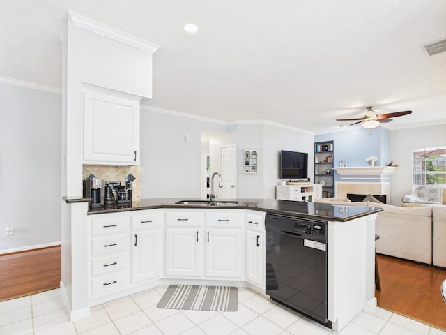 3707 Scenic Valley Dr, Kingwood, TX 77345 - kitchen featuring black dishwasher, a sink, ceiling fan, open floor plan, and a peninsula