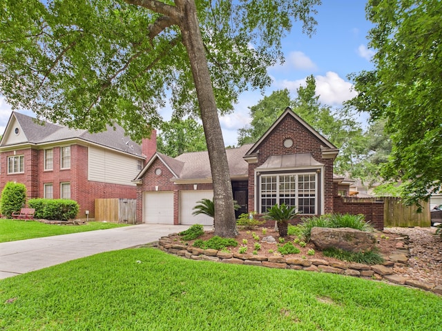 3707 Scenic Valley Dr, Kingwood, TX 77345 - colonial inspired home featuring an attached garage, brick siding, concrete driveway, and a chimney
