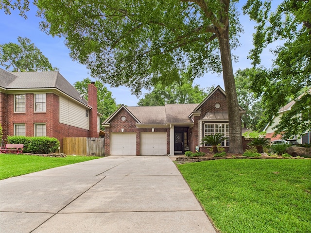 3707 Scenic Valley Dr, Kingwood, TX 77345 - view of front of house featuring brick siding, a garage, concrete driveway, and a chimney