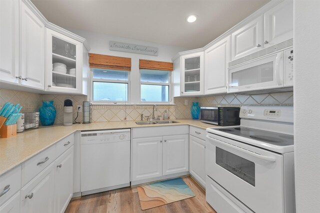 4003 Indian Beach Dr, Galveston, TX 77554 - kitchen featuring white appliances, a sink, white cabinets, and recessed lighting
