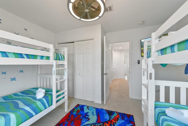 4003 Indian Beach Dr, Galveston, TX 77554 - bedroom with attic access, carpet flooring, a closet, and baseboards