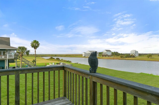 4003 Indian Beach Dr, Galveston, TX 77554 - wooden deck with a water view and a yard