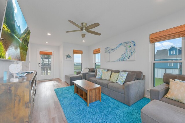 4003 Indian Beach Dr, Galveston, TX 77554 - living room with a ceiling fan, plenty of natural light, recessed lighting, light wood finished floors, and baseboards