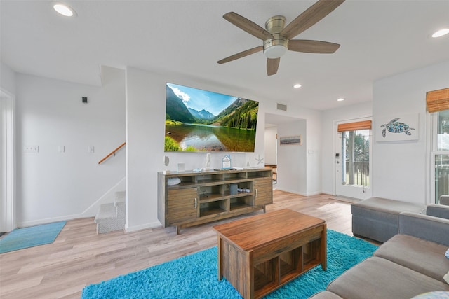 4003 Indian Beach Dr, Galveston, TX 77554 - living room with ceiling fan, recessed lighting, light wood-type flooring, stairway, and baseboards