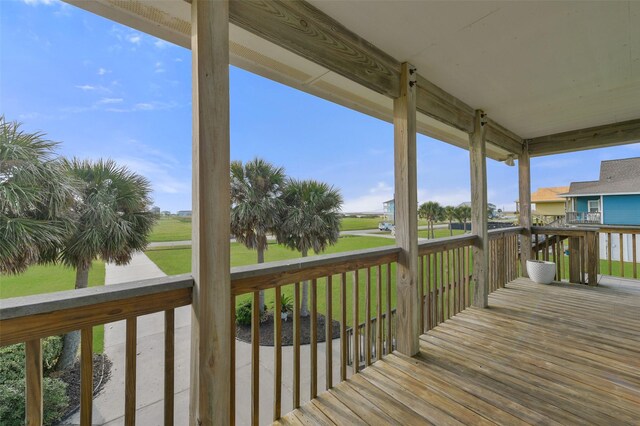 4003 Indian Beach Dr, Galveston, TX 77554 - wooden terrace with a lawn