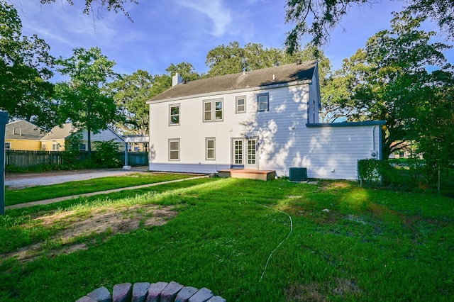 1031 Meyer St, Sealy, TX 77474 - back of property featuring a chimney, a patio, and french doors