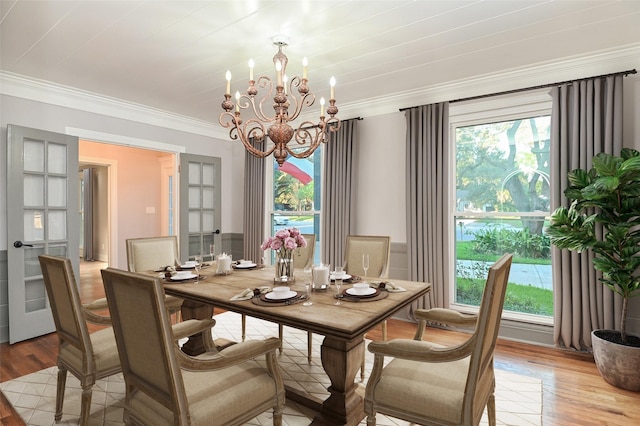 1031 Meyer St, Sealy, TX 77474 - dining space featuring a chandelier, light wood-style flooring, and crown molding