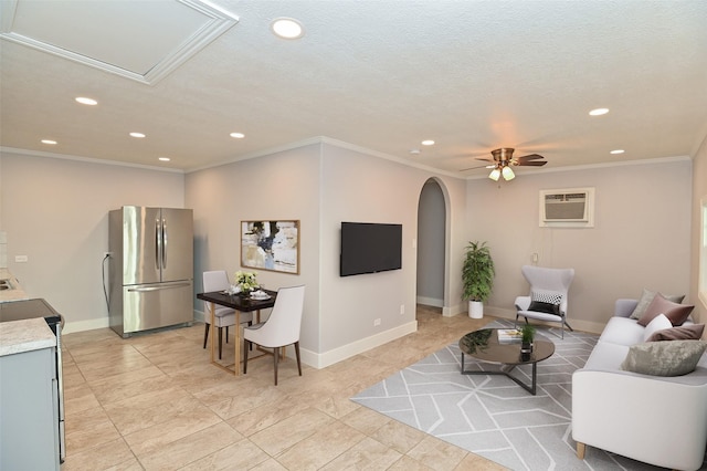 1031 Meyer St, Sealy, TX 77474 - living room featuring recessed lighting, arched walkways, a wall mounted AC, crown molding, and ceiling fan