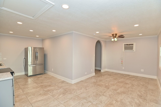 1031 Meyer St, Sealy, TX 77474 - spare room with recessed lighting, an AC wall unit, arched walkways, a ceiling fan, and crown molding