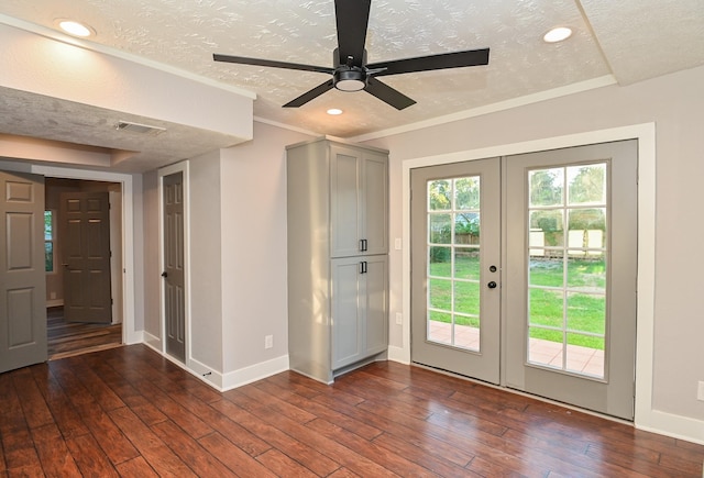 1031 Meyer St, Sealy, TX 77474 - doorway featuring french doors, a textured ceiling, dark wood-style flooring, a ceiling fan, and recessed lighting