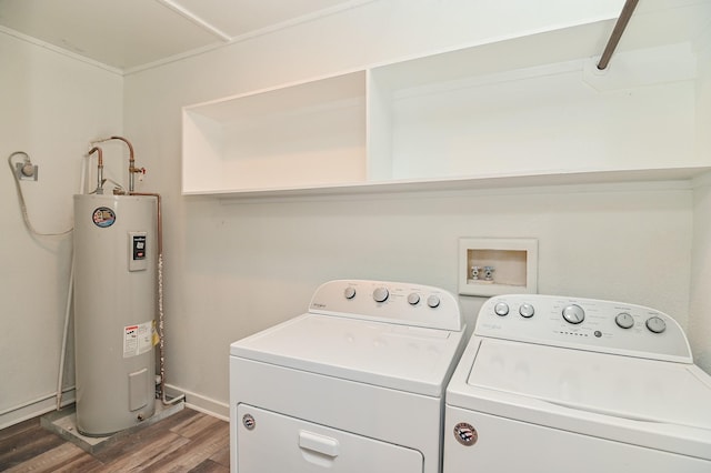 1031 Meyer St, Sealy, TX 77474 - washroom featuring electric water heater, separate washer and dryer, and wood finished floors