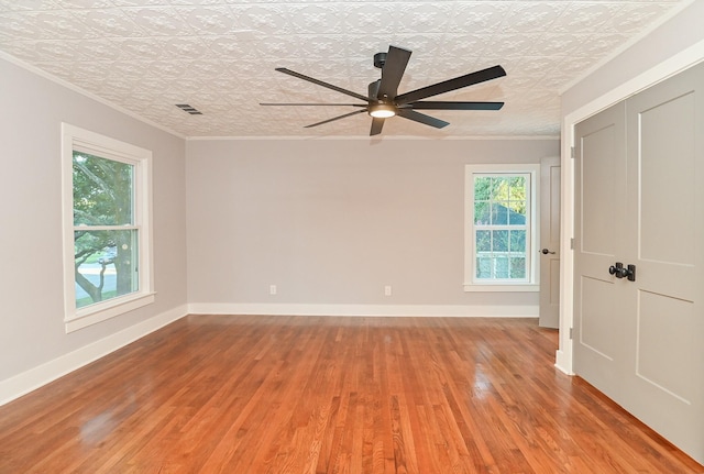 1031 Meyer St, Sealy, TX 77474 - spare room with light wood-style floors, an ornate ceiling, ornamental molding, and ceiling fan