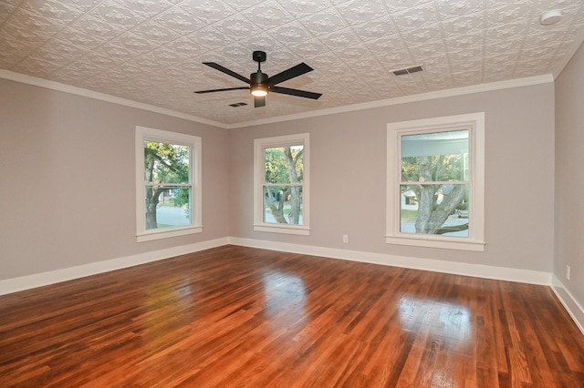1031 Meyer St, Sealy, TX 77474 - spare room featuring wood finished floors, crown molding, an ornate ceiling, ceiling fan, and a smoke detector