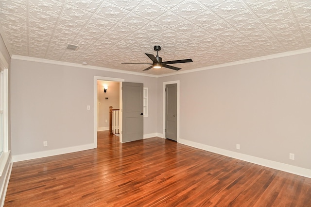 1031 Meyer St, Sealy, TX 77474 - unfurnished room featuring an ornate ceiling, wood finished floors, ornamental molding, and a ceiling fan