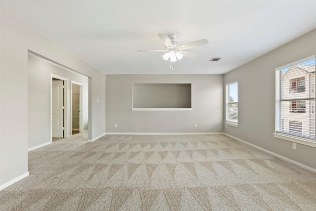 8315 Greys Ln, Houston, TX 77095 - unfurnished room with light carpet, ceiling fan, and baseboards